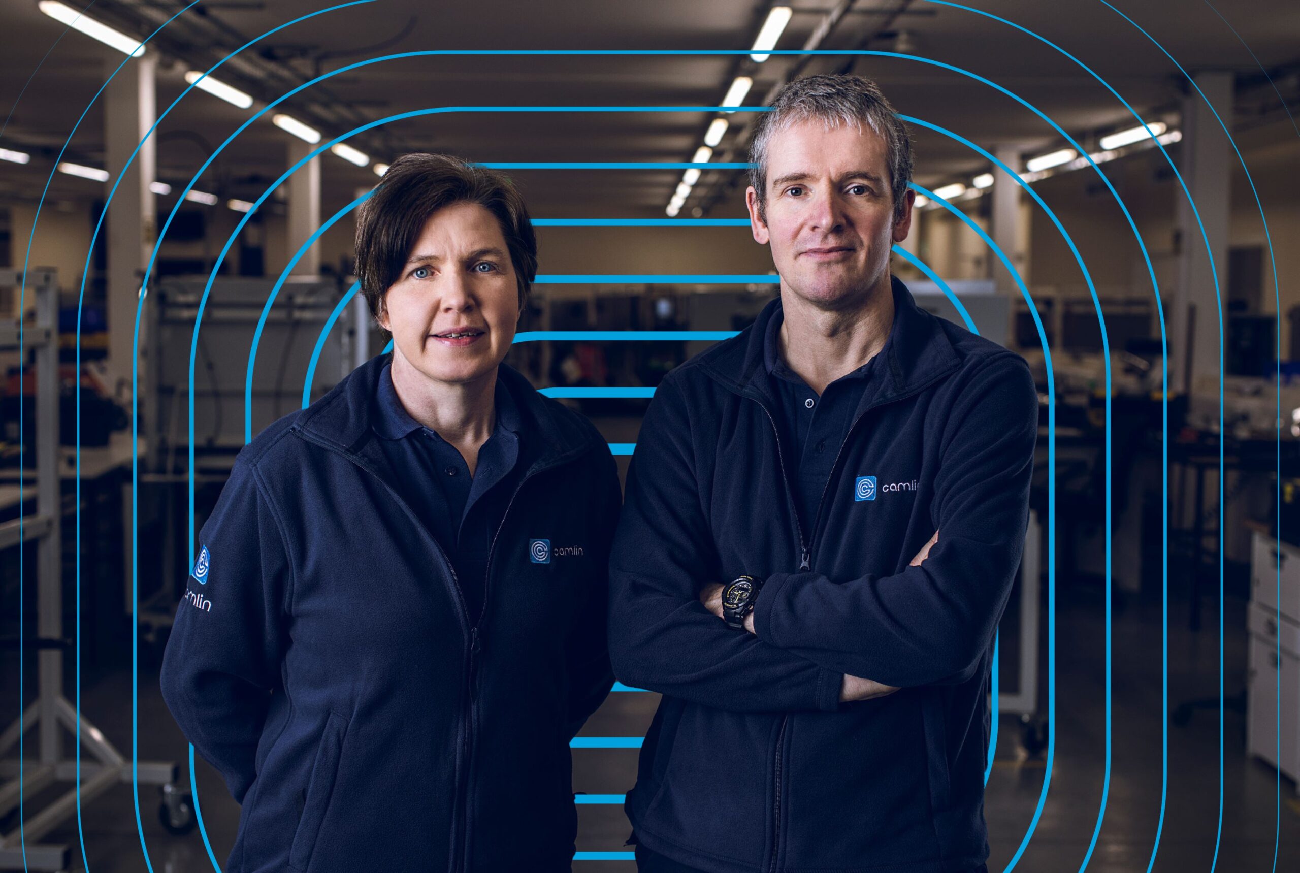 2 people looking out of a workshop