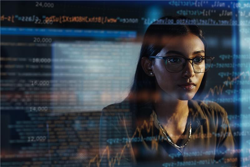 A lady in front of a computer screen